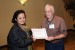 Dr. Jeremy Horne, Program committee Chair, giving Dr. Shanta Mridula the best paper award of the session "Design and Modeling." The title of the awarded paper is ''Time Domain Modeling of a Band-Notched Antenna for UWB Applications.''